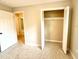 Bedroom with an open closet and a doorway to another room, offering flexibility at 135 E Columbia St, Lake Alfred, FL 33850