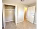 Bedroom with closet featuring ample storage space for an organized wardrobe at 135 E Columbia St, Lake Alfred, FL 33850