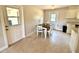 Cozy dining area with table and chairs, conveniently located near the kitchen and backyard access at 135 E Columbia St, Lake Alfred, FL 33850