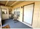 Cozy screened porch with seating, perfect for relaxing and enjoying the outdoors at 135 E Columbia St, Lake Alfred, FL 33850
