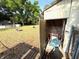 Backyard shed containing lawn equipment and outdoor tools at 135 E Columbia St, Lake Alfred, FL 33850