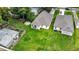 Aerial view of a home with a spacious backyard and outdoor basketball court, and detached garage at 1415 S Lincoln Ave, Lakeland, FL 33803