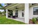 Outdoor back porch with outdoor seating furniture and a ceiling fan at 1415 S Lincoln Ave, Lakeland, FL 33803