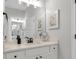 Elegant bathroom with a white vanity, black hardware, and a large mirror reflecting the bright interior at 1415 S Lincoln Ave, Lakeland, FL 33803