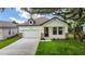 Inviting single Gathering home with a two-car garage and a quaint front porch entrance at 1415 S Lincoln Ave, Lakeland, FL 33803