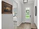 Inviting hallway view with a glimpse into the bedroom, showcasing a peaceful interior at 1415 S Lincoln Ave, Lakeland, FL 33803