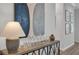 Stylish interior featuring a console table, decorative lamp, glassware, and modern wall art at 1415 S Lincoln Ave, Lakeland, FL 33803