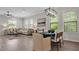 Open-concept living room with a dining area and comfortable seating arrangement, perfect for modern living at 1415 S Lincoln Ave, Lakeland, FL 33803