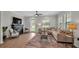 Bright living room with a decorative fireplace and comfortable sectional sofa, ideal for relaxation at 1415 S Lincoln Ave, Lakeland, FL 33803