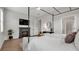 Bedroom featuring a modern fireplace, TV, and stylish decor, creating a cozy retreat at 1415 S Lincoln Ave, Lakeland, FL 33803