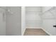 Spacious walk-in closet with ample shelving and modern flooring for organized storage at 1415 S Lincoln Ave, Lakeland, FL 33803