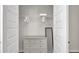 Organized walk-in closet with a dresser and shelving behind classic double doors at 1415 S Lincoln Ave, Lakeland, FL 33803
