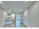 Bright living room with modern floors and neutral wall color at 1525 Leamington Ln, Winter Haven, FL 33884