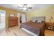 Bedroom featuring a large dresser, hardwood floors, and a walk-in closet at 16 Golfview Ne Cir, Winter Haven, FL 33881