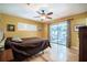 Bedroom featuring a sliding glass door, hardwood floors, and a ceiling fan at 16 Golfview Ne Cir, Winter Haven, FL 33881