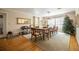 Traditional dining room with hardwood floors, large windows, and ample seating for formal gatherings at 16 Golfview Ne Cir, Winter Haven, FL 33881