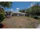 Attractive single-story home with a brick facade and a spacious front yard at 16 Golfview Ne Cir, Winter Haven, FL 33881