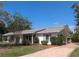 Charming single-story home with well-maintained landscaping and a brick-paved driveway leading to the entrance at 16 Golfview Ne Cir, Winter Haven, FL 33881