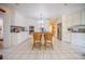 Spacious kitchen featuring white cabinets, stainless steel appliances, and a center island with seating at 16 Golfview Ne Cir, Winter Haven, FL 33881