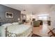 Open concept living area showcasing a fireplace, hardwood floors, and comfortable furnishings at 16 Golfview Ne Cir, Winter Haven, FL 33881