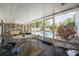 Spacious screened porch overlooking the pool area, furnished with comfortable seating for outdoor relaxation at 16 Golfview Ne Cir, Winter Haven, FL 33881