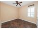 Bright bedroom featuring tile floors and a window with plantation shutters at 1772 Laurel Glen Pl, Lakeland, FL 33803