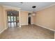 Open dining space leading into the living and kitchen areas, with neutral wall colors at 1772 Laurel Glen Pl, Lakeland, FL 33803