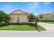 Charming one-story house with a well-kept lawn and a neat garden landscape at 1772 Laurel Glen Pl, Lakeland, FL 33803