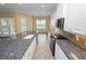 This kitchen features sleek granite countertops, stainless appliances, white cabinets and lots of natural light at 1772 Laurel Glen Pl, Lakeland, FL 33803