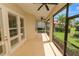 Spacious screened lanai with ceiling fans and views of the landscaped backyard at 1772 Laurel Glen Pl, Lakeland, FL 33803