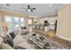 Open-concept living space connects the living room, dining area, and kitchen with bar seating at 1772 Laurel Glen Pl, Lakeland, FL 33803