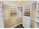 Spacious walk-in closet featuring multiple shelves and drawers at 1772 Laurel Glen Pl, Lakeland, FL 33803
