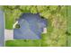 Overhead view of the home showing the roof, mature trees, and yard at 1837 Farrington Dr, Lakeland, FL 33809
