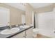 Bathroom featuring double sinks, vanity, and shower and tub combo at 1837 Farrington Dr, Lakeland, FL 33809