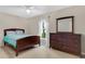 Bedroom with a full-size bed and dresser at 1837 Farrington Dr, Lakeland, FL 33809