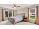 Bedroom with two windows and a ceiling fan at 1837 Farrington Dr, Lakeland, FL 33809