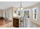 Bright dining area features a wooden table and seating with a view of the backyard at 1837 Farrington Dr, Lakeland, FL 33809