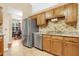 Kitchen with stainless steel appliances, granite countertops, and wood cabinets at 1837 Farrington Dr, Lakeland, FL 33809
