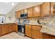 Kitchen featuring granite counters, tile backsplash, and stainless steel appliances at 1837 Farrington Dr, Lakeland, FL 33809