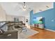 Open living room with high ceilings, modern furnishings, and a large flat-screen TV at 1837 Farrington Dr, Lakeland, FL 33809