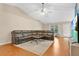 Spacious living room with vaulted ceilings, a comfortable sectional sofa, and hardwood floors at 1837 Farrington Dr, Lakeland, FL 33809