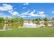 Beautiful water view showcasing a serene lake with a dock and lush green surroundings at 1837 Farrington Dr, Lakeland, FL 33809