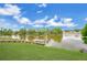 Panoramic water view of a tranquil lake surrounded by lush greenery and clear blue skies at 1837 Farrington Dr, Lakeland, FL 33809