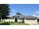 Charming one-story home featuring a well-maintained lawn and a two-car garage at 200 S Goodman Ave, Lake Alfred, FL 33850
