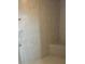 Tiled shower featuring integrated bench and shelving at 200 S Goodman Ave, Lake Alfred, FL 33850
