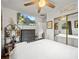 Bedroom showcasing a ceiling fan, ample closet space, and a comfortable bed at 209 W Crescent Dr, Lakeland, FL 33805