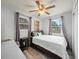 Bright bedroom with ceiling fan, two windows and neutral decor at 209 W Crescent Dr, Lakeland, FL 33805