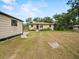 Charming home featuring a well-maintained lawn and a detached storage shed at 209 W Crescent Dr, Lakeland, FL 33805