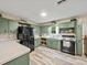 Functional kitchen with essential appliances and ample counter space at 209 W Crescent Dr, Lakeland, FL 33805