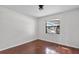 Bright bedroom showcases hardwood floors, a window with natural light, and a ceiling fan at 2173 Castle Pt, Winter Haven, FL 33880